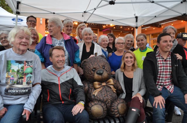 Everyone surrounding the Teddy Bear